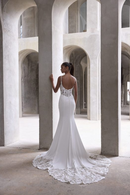 Morilee Amaris 2986 sheath wedding dress, with a low scoop back and lace cutaway train