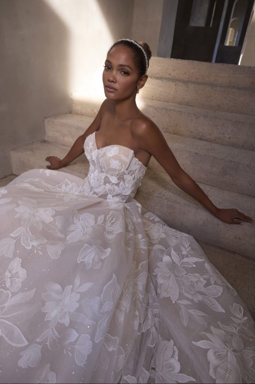 Morilee Rodyn 2937 Ballgown strapless wedding dress with cat eye neckline, floral threadwork appliqued tulle and detachable long puff sleeves.