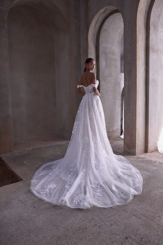 Morilee Filippa 2979 is an A-line wedding dress with a plunging sweetheart neckline and detachable off-the-shoulder straps.
