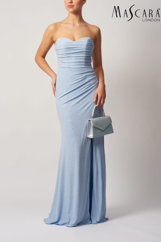 Style MC16201 fitted glitter prom dress with a tie-up back and skirt slit.