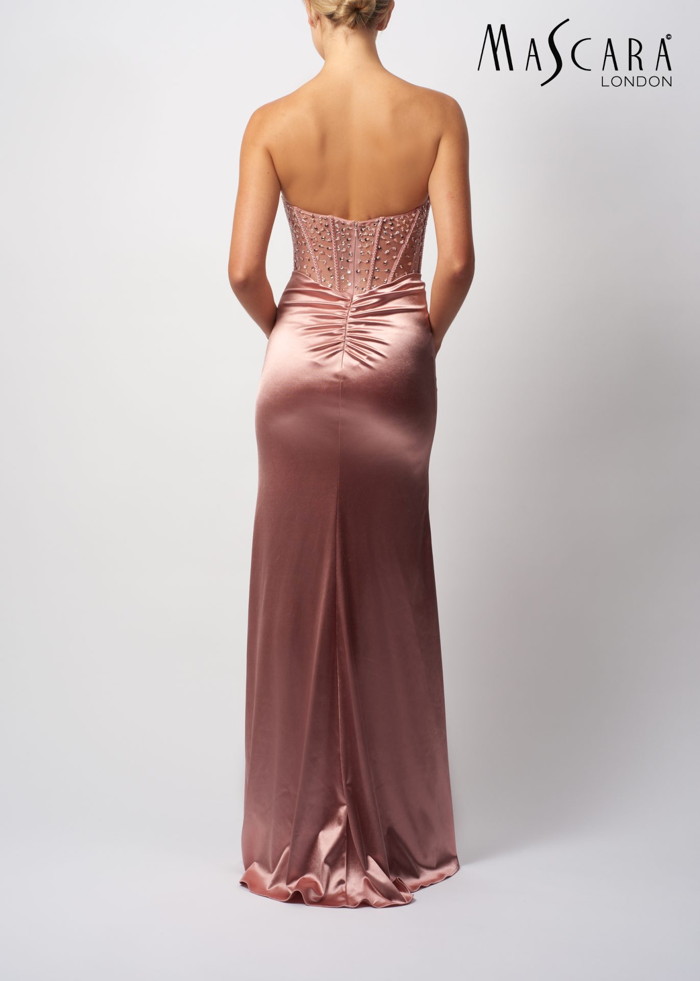 MC11433 MC11433 A fitting satin prom dress with a beaded corset top and a side split in the skirt. Available Colours: Rose, Berry & Airforce.