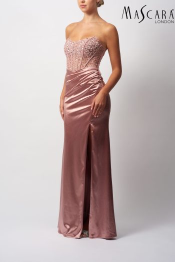MC11433 A fitting satin and beaded prom dress with a side split.