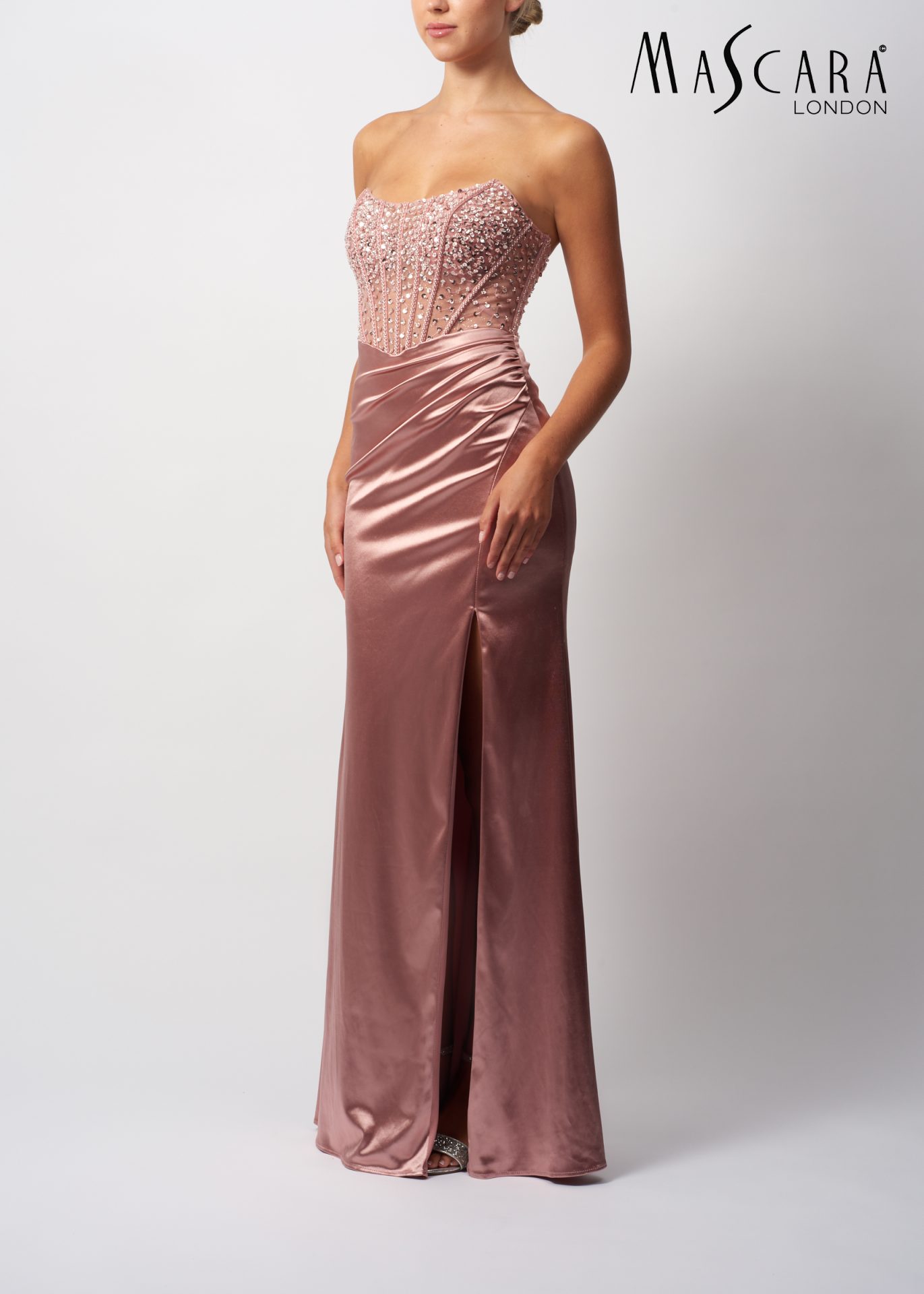 mc11433 MC11433 A fitting satin and beaded prom dress with a side split.