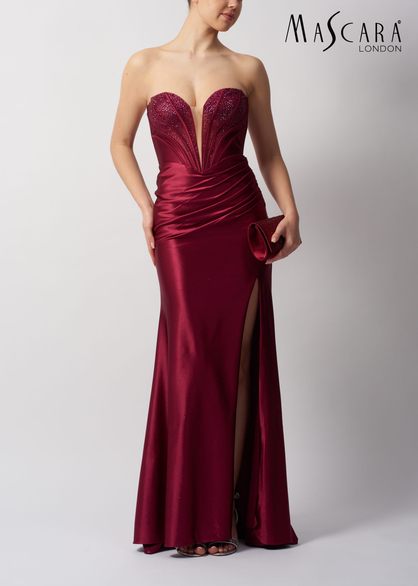 MC113443 Style MC113443 fitted satin prom dress with plunge neckline and beaded top.