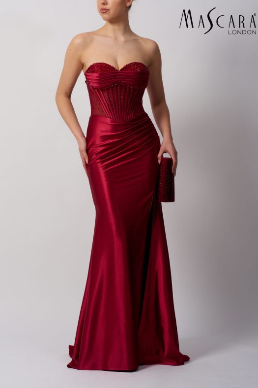 Style MC113423 a fitted satin prom dress with beaded top and tie-up back. comes in many colours.