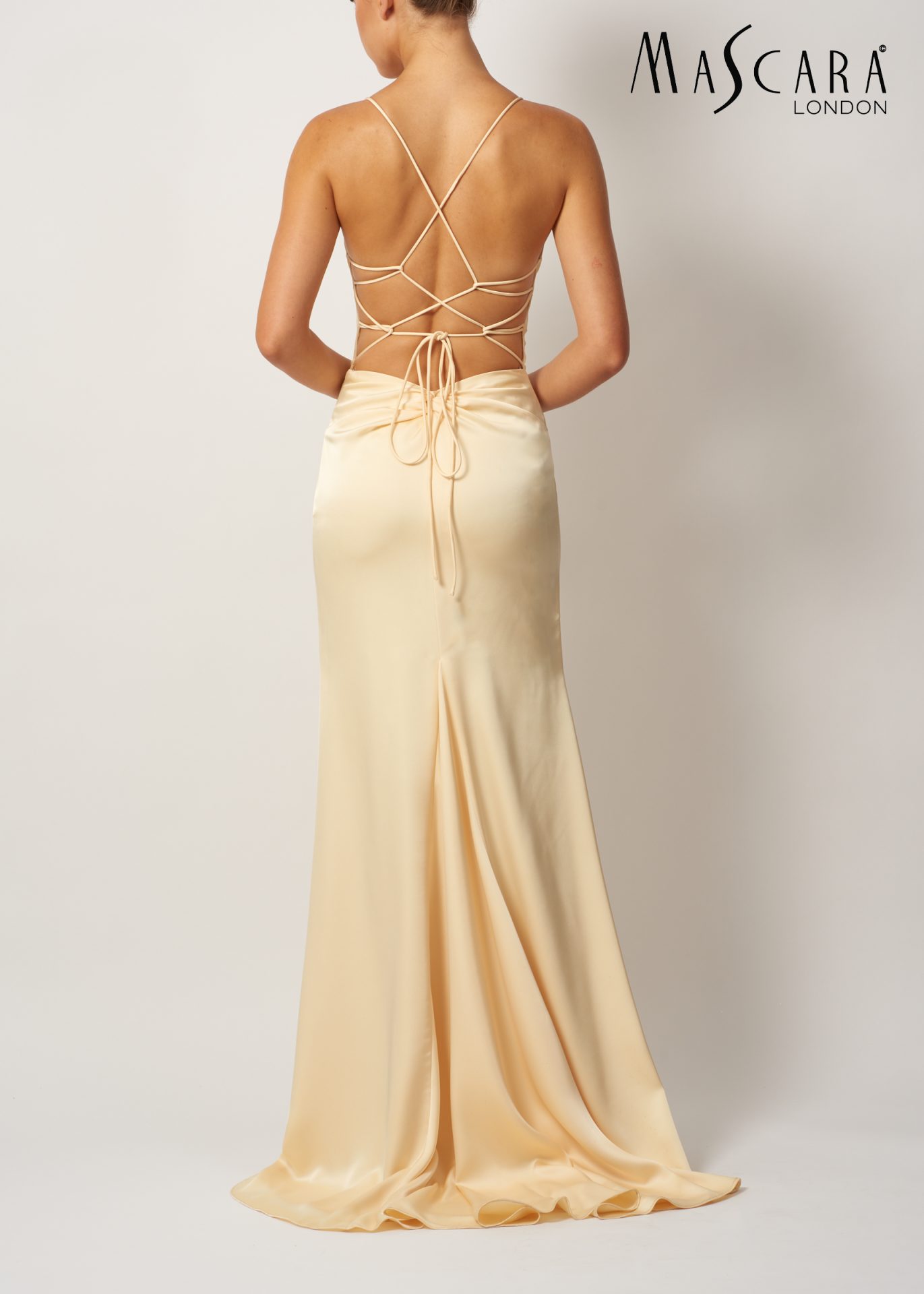 MC192017 MC192017 A fitted satin prom dress with a low tie-up back