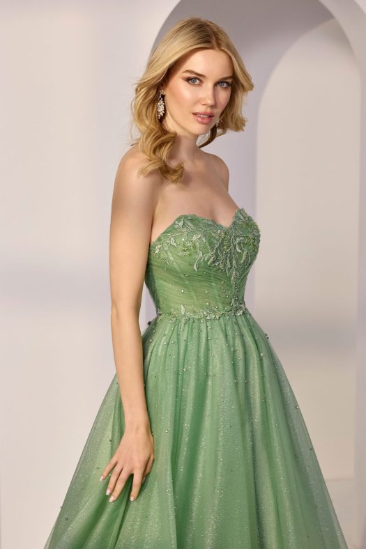 A-line Morilee tulle prom strapless dress. Sweet heart neckline on a beaded glitter bodice.