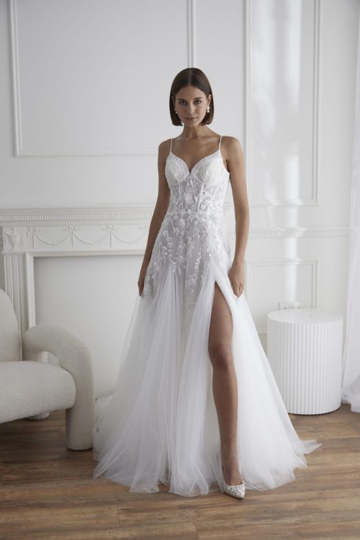 Madison an embroidered A-line tulle wedding dress. with a split. A Miamia gown by Marguerite Hannha.
