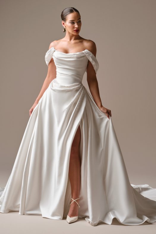 Sottero and Midgley wedding dress Kincaid. Beaded satin ballgown with pearl back buttons trailing to the hem.