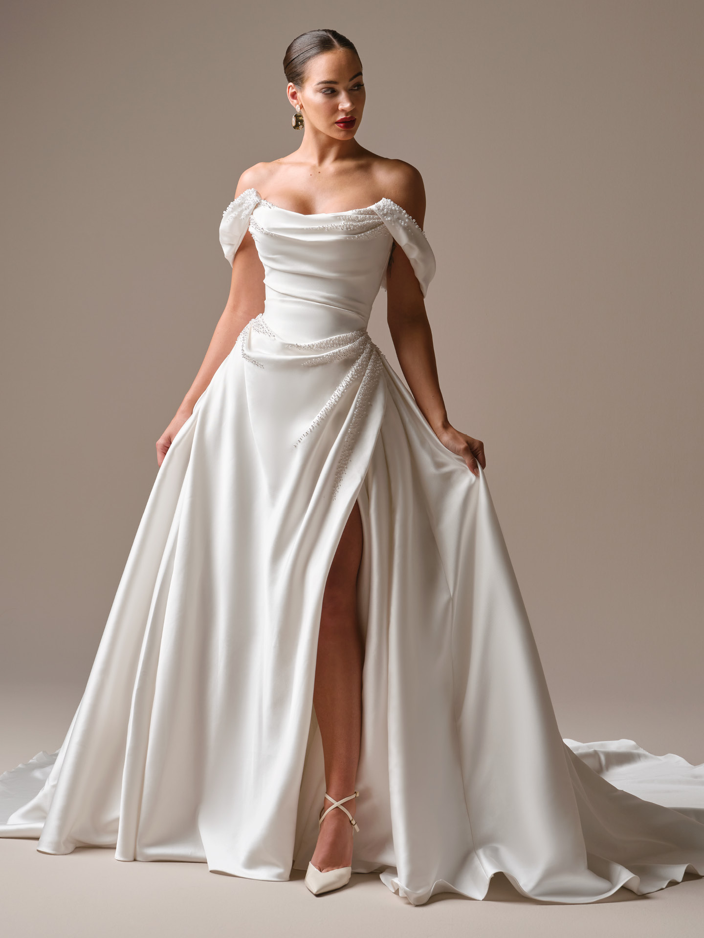 Sottero and Midgley wedding dress Kincaid. Beaded satin ballgown with pearl back buttons trailing to the hem.